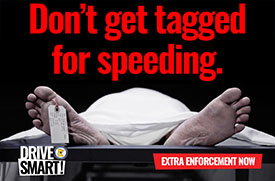 A campaign ad with a body under a sheet with feet sticking out and a tag on one toe. Text: Don't get tagged for speeding. Drive Smart. Extra enforcement now.