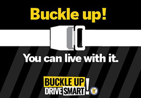 A seat belt and text that says Buckle Up! You can live with it.