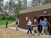Regional emergency managers joined HSEM Director Joe Kelly in a tour of one of two safe rooms at Camp Wilderness