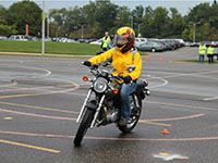 A rider navigating a motorcycle training course