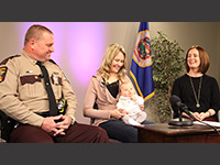 Photo of State Patrol Lt. Paul Stricker, Kristin and Elise Lonsbury, and Virginia Marsh.