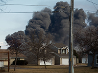 Smoke from the explosion at the Husky Oil Refinery in Superior, Wis., rises over homes nearby