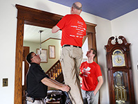 State Fire Marshal Bruce West helped Red Cross volunteers install five free smoke alarms