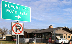 Report for Road Test sign at an exam station