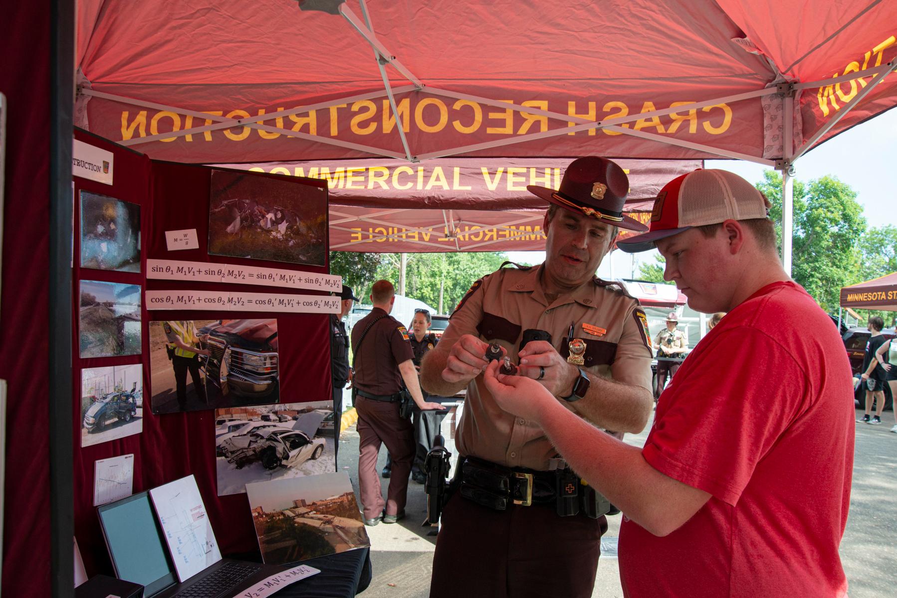 trooper showing another person something while talking