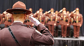 Troopers saluting at graduation