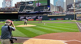 Trooper Gustavo Culbeaux throwing from the pitcher's mound at Target Field.