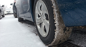 Close-up of tires on a snowy road