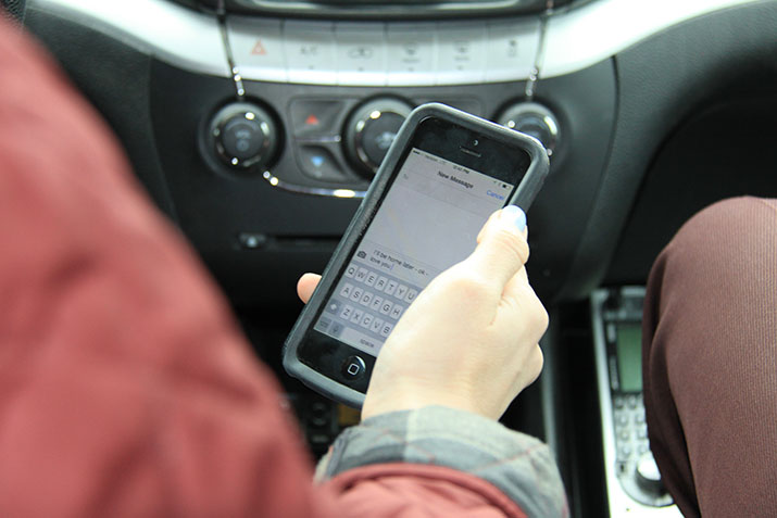 A driver holding a smartphone