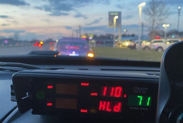 Squad car radar screen showing a driver's speed at 110 mph