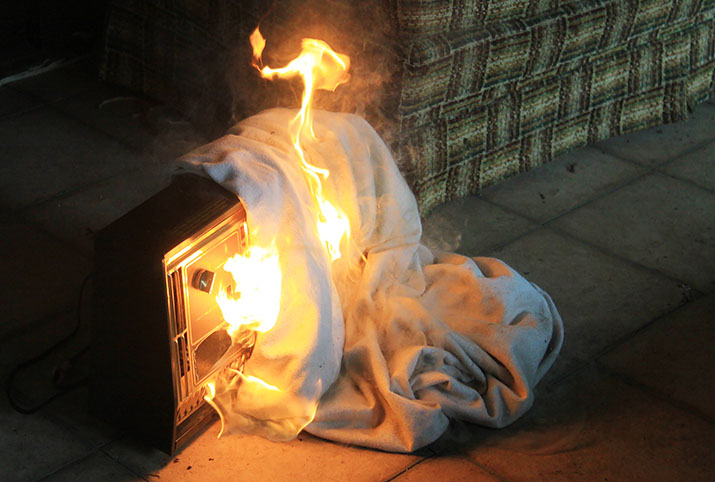 A blanket catching fire on a space heater