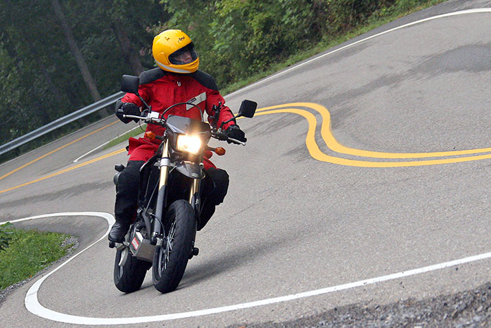 A motorcyclist on a curvy road