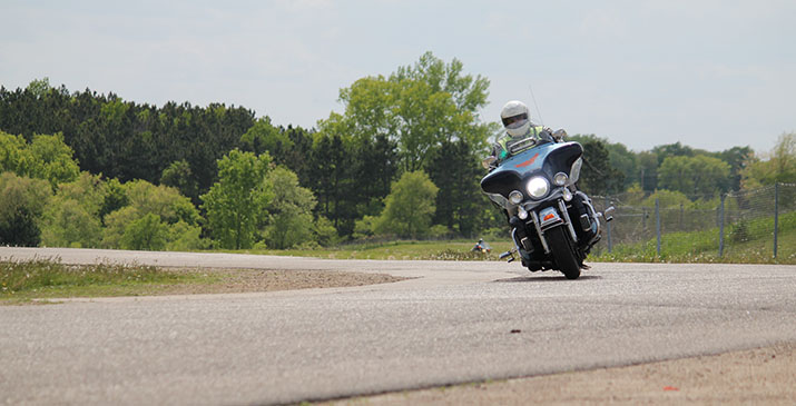 A motorcyclist taking a curve on a road