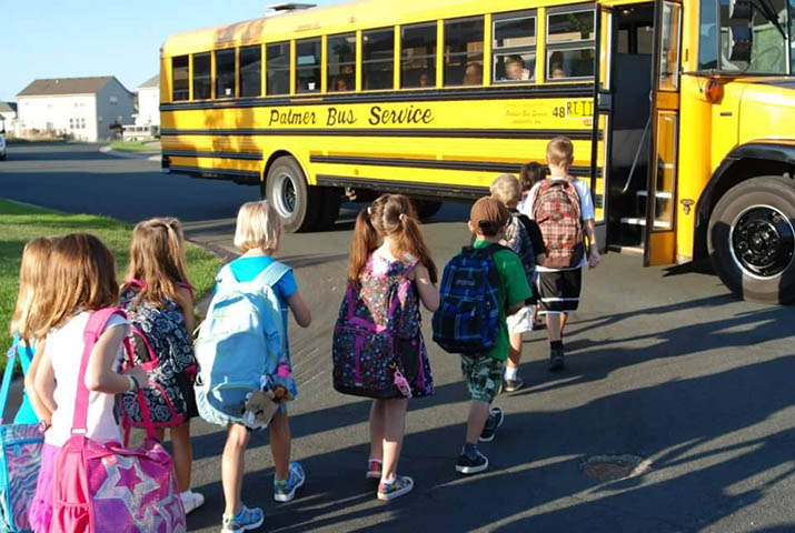 Children boarding a school bus