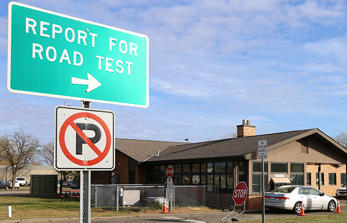 Report for Road Test sign at an exam station