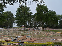 Debris scattered on the ground after an explosion that killed two people in their Marshall, Minnesota, home