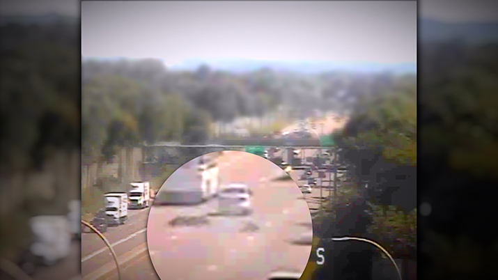 Photo from a traffic cam of a motorcycle crash.