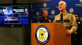 Sgt. Kyle Puelston speaks during a news conference.
