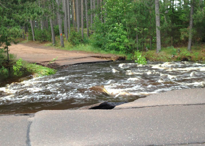 Photo of a storm-damaged road.
