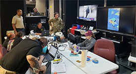 First responders work in a mobile command center