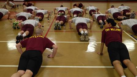 Troopers in training scenario doing push-ups