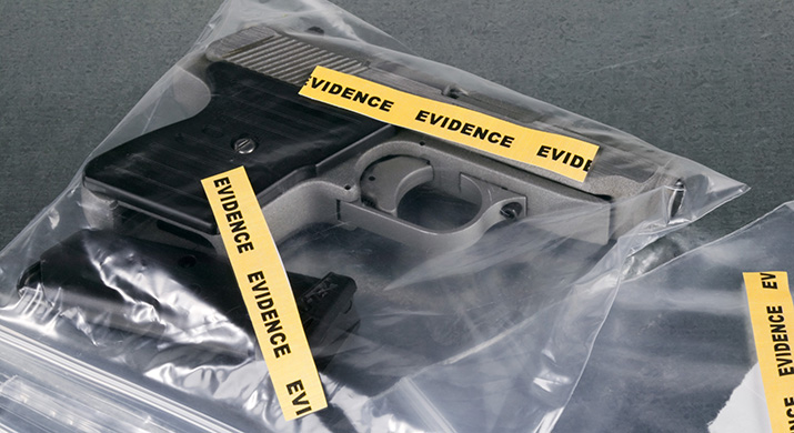 A handgun in an evidence bag