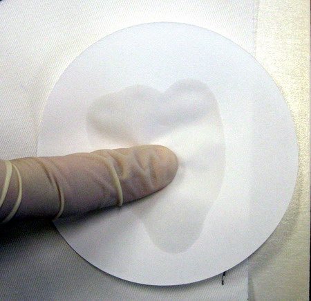 the bullet hole is tested by transferring lead to a filter paper with an acidic solution on it
