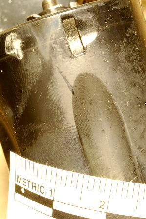 a revolver with a visible print on the cylinder that was further enhanced by fuming with cyanoacrylate