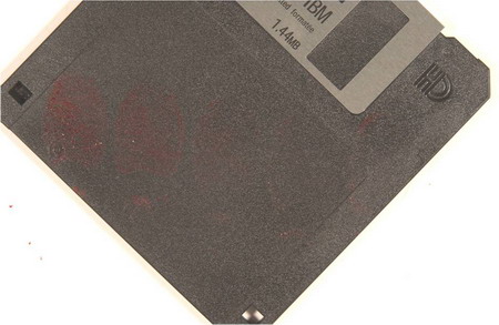 fingerprints in blood on a black floppy disc