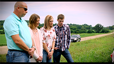 The Maas family visits the roadside memorial for Logan