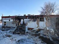 A burned out trailer home in Alexandria after a fatal fire cause by careless smoking