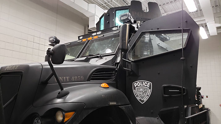 An armored vehicle with the City of New Hope Police Department's patch on the door