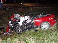 A destroyed vehicle at a car crash scene