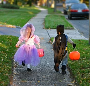 Kids running in Halloween costumes