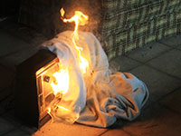 A blanket over a space heater catches fire