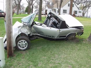 Photo of car that crashed into a pole.