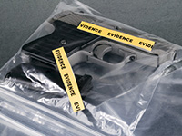 A handgun in an evidence bag