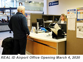 A DVS staff member talks with a traveler at the MSP Airport REAL ID office.